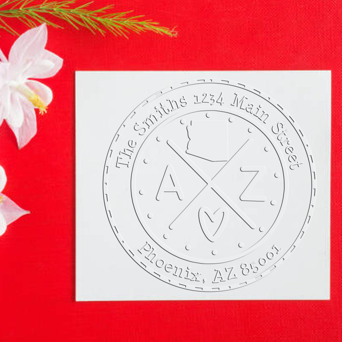 White embossed stamp and seal with A Z monogram on red background, labeled The Smiths, Phoenix AZ 85001.