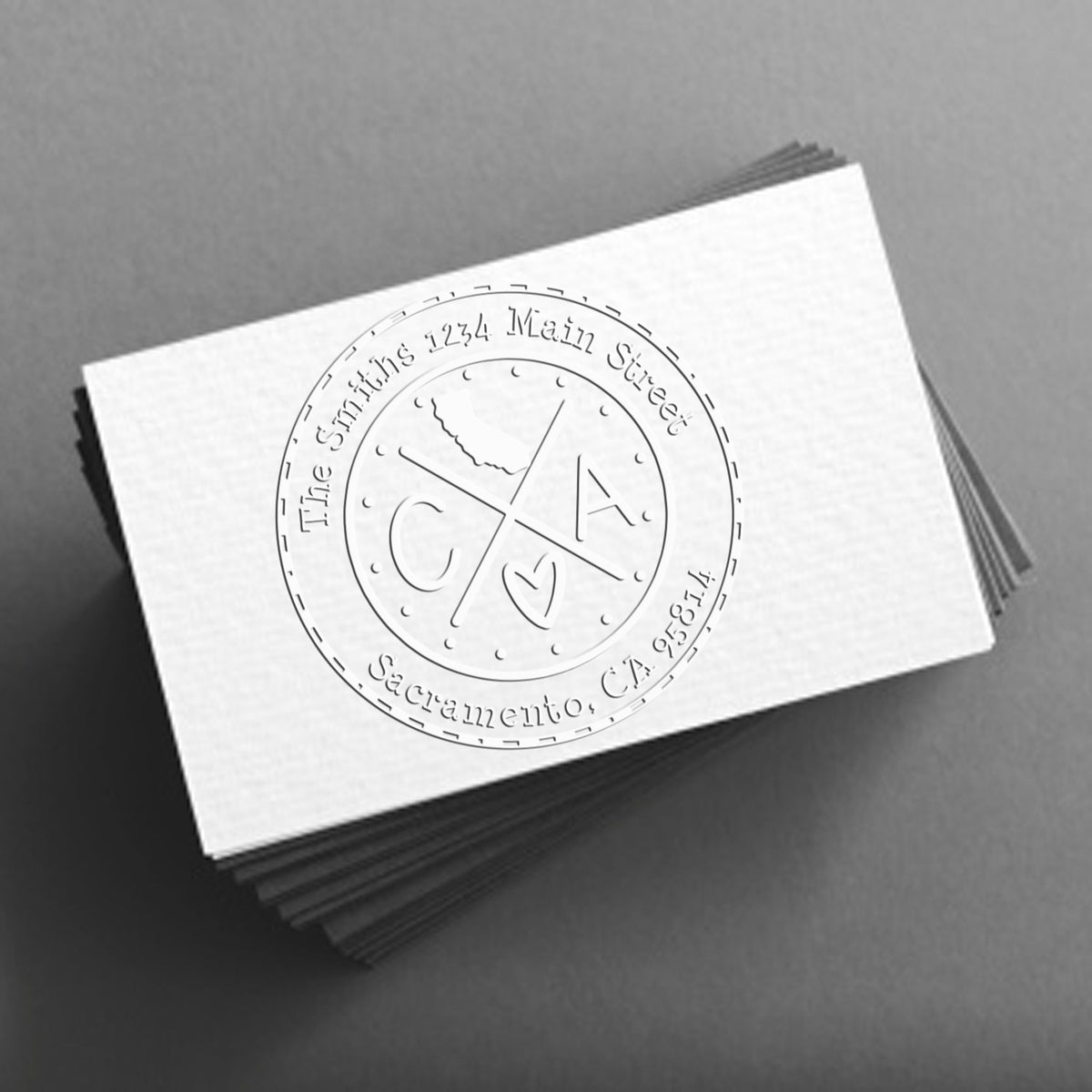 Trodat State Cross Hybrid Customizable Address Seal Embosser for California from State Love Stamps, showing the seal in use.