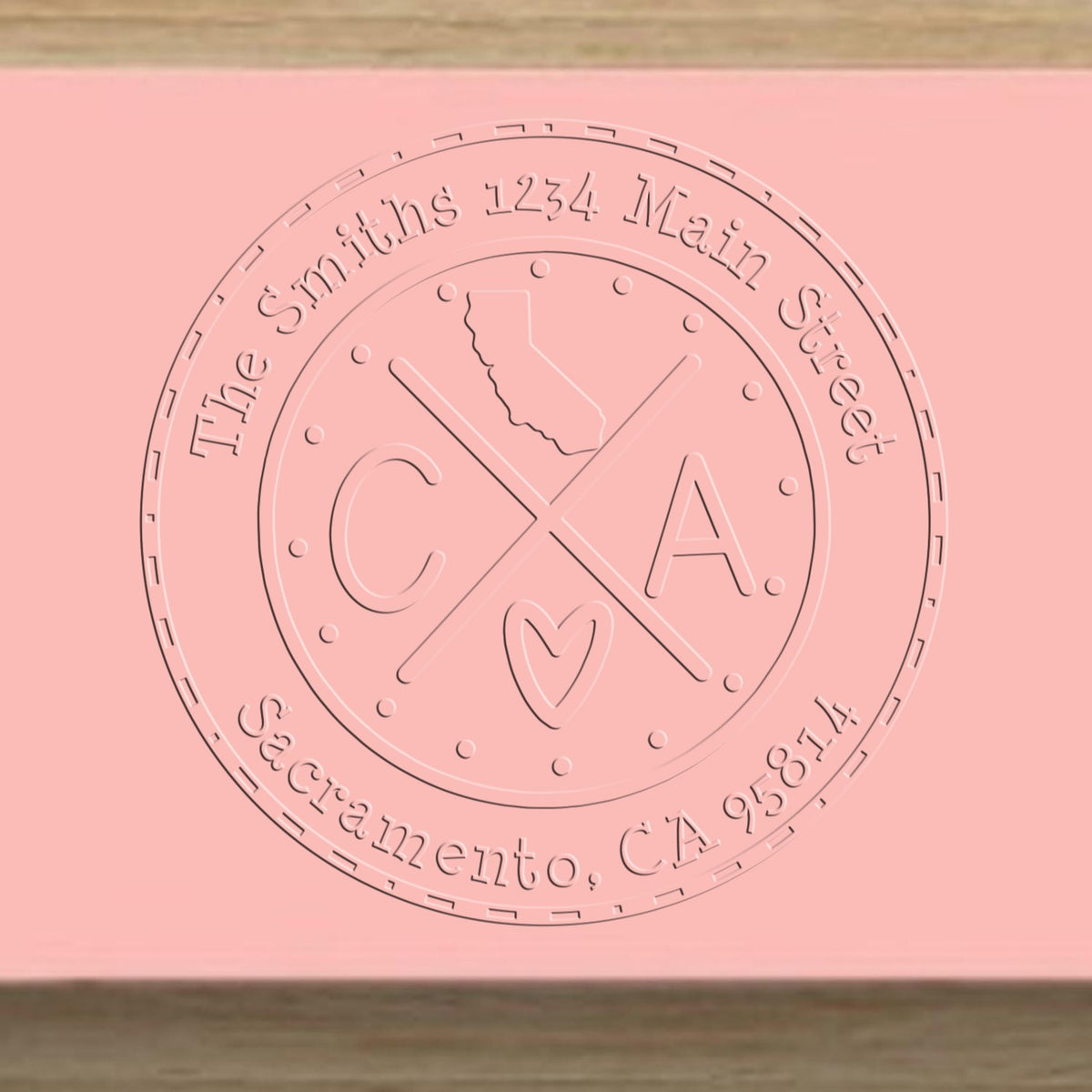 Trodat State Cross Hybrid California address seal embosser from State Love Stamps, in use with visible embossed design.