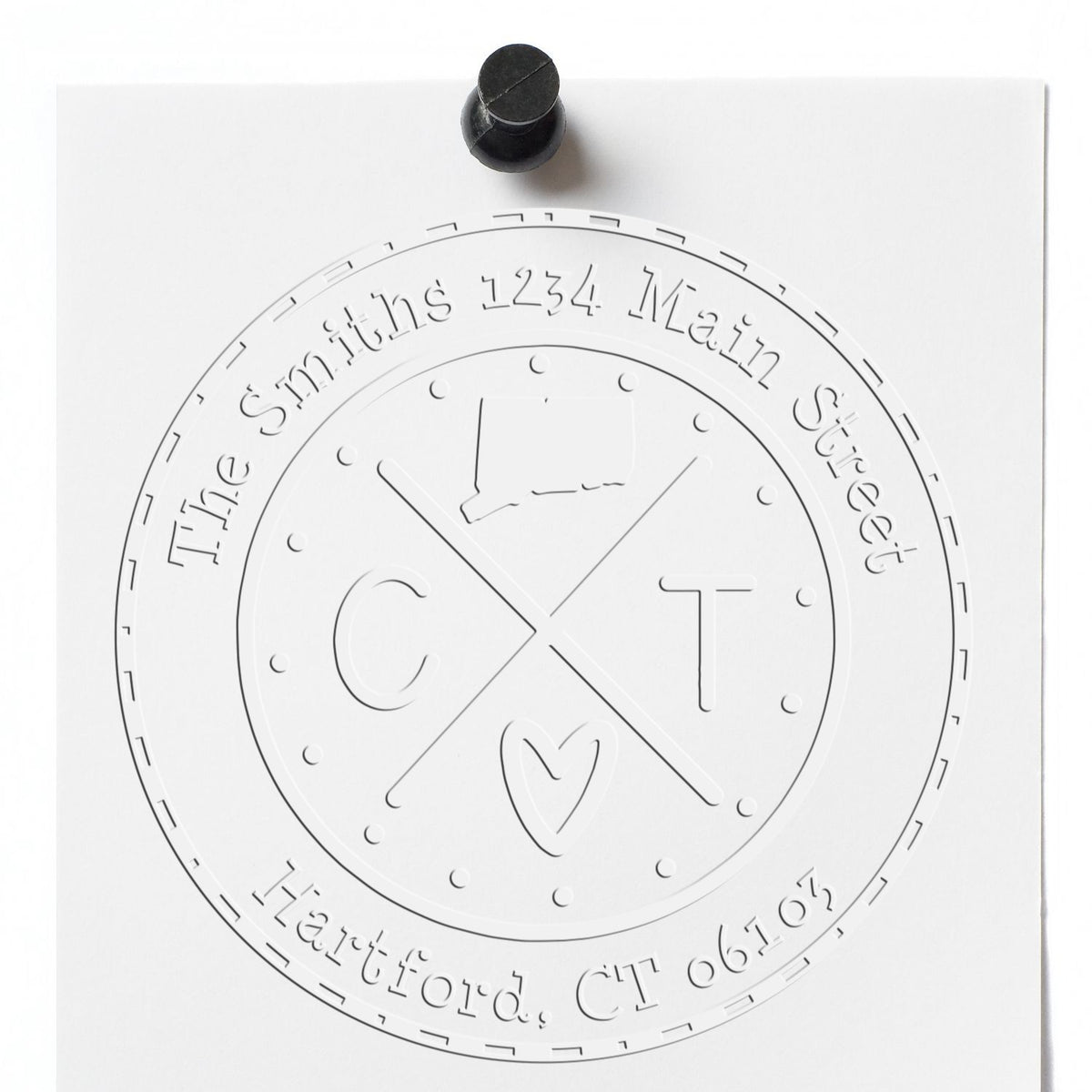 White embossed circular address seal with black stamp, reading The Smiths, 1234 Main Street, Hartford, CT 06102, with CT monogram.