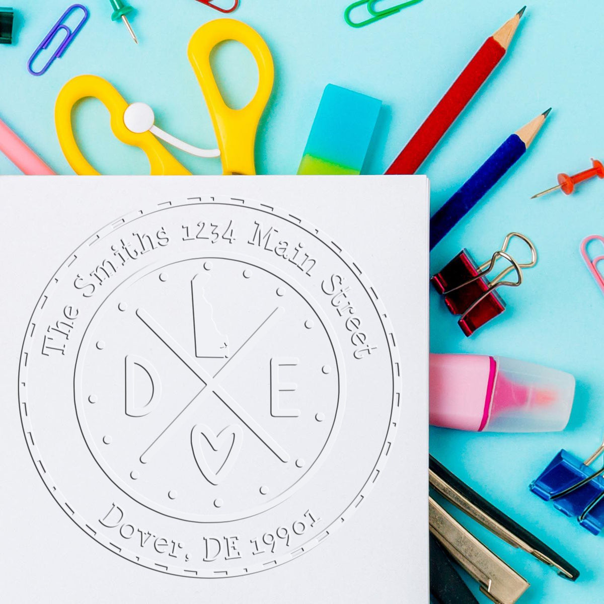 Trodat State Cross Hybrid Customizable Address Seal for Delaware, embossed with state design, in use on paper.