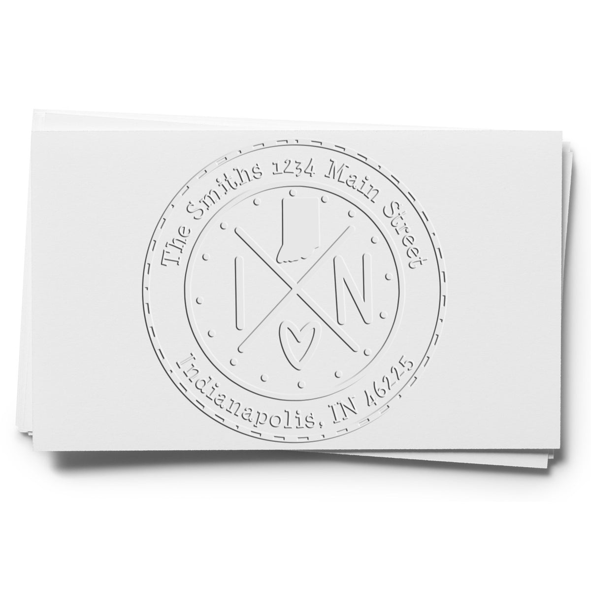 White embossed round stamp seal with initials, heart, and address text for The Smiths, 1234 Main Street, Indianapolis, IN 46225