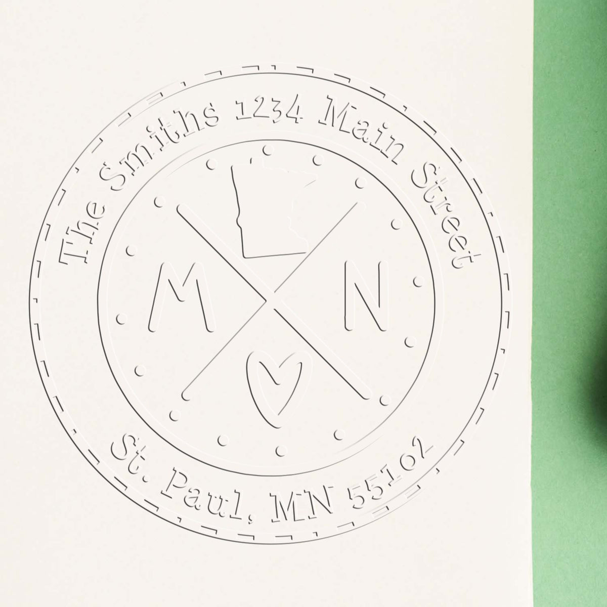 Trodat State Cross Hybrid Customizable Minnesota Address Embossing Stamp showing the in-use seal with embossed address details.