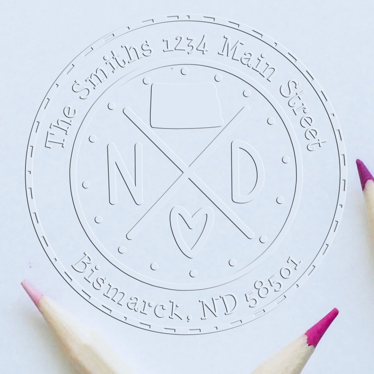 White round embossing seal stamp for The Smiths, 1234 Main Street, Bismarck, ND 58501, with ND and heart logo