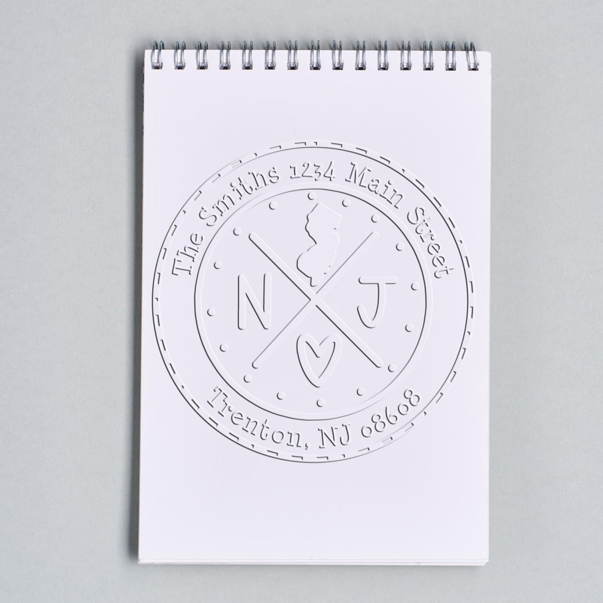 Trodat State Cross Hybrid New Jersey address stamp embossing a return address with a customizable state seal design.