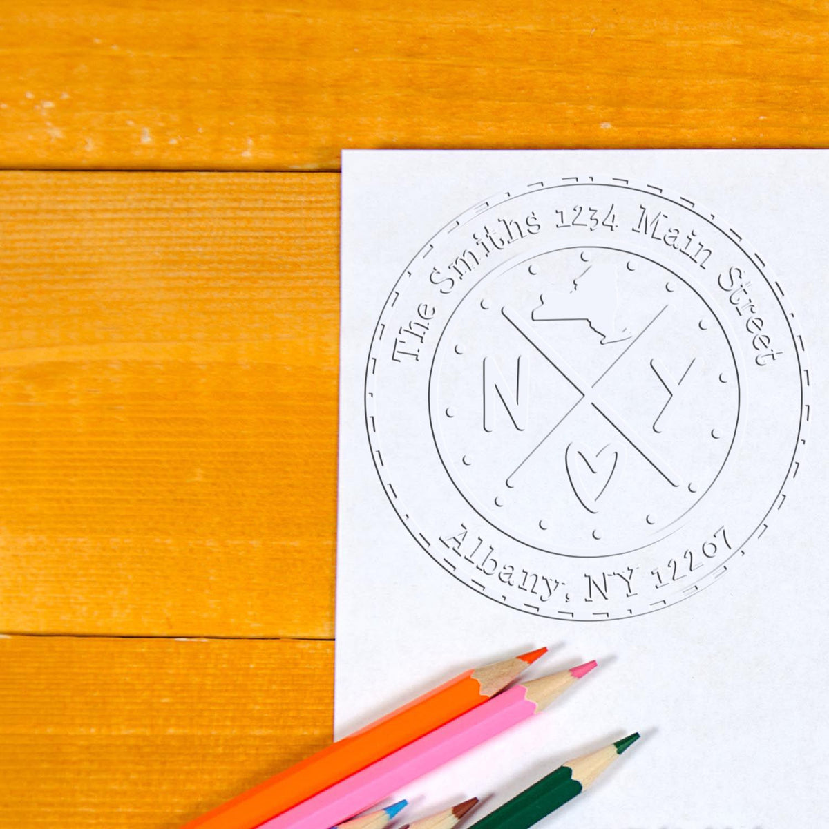 Trodat State Love Stamps New York cross hybrid embossed return address seal in use, featuring customizable design with New York state outline.