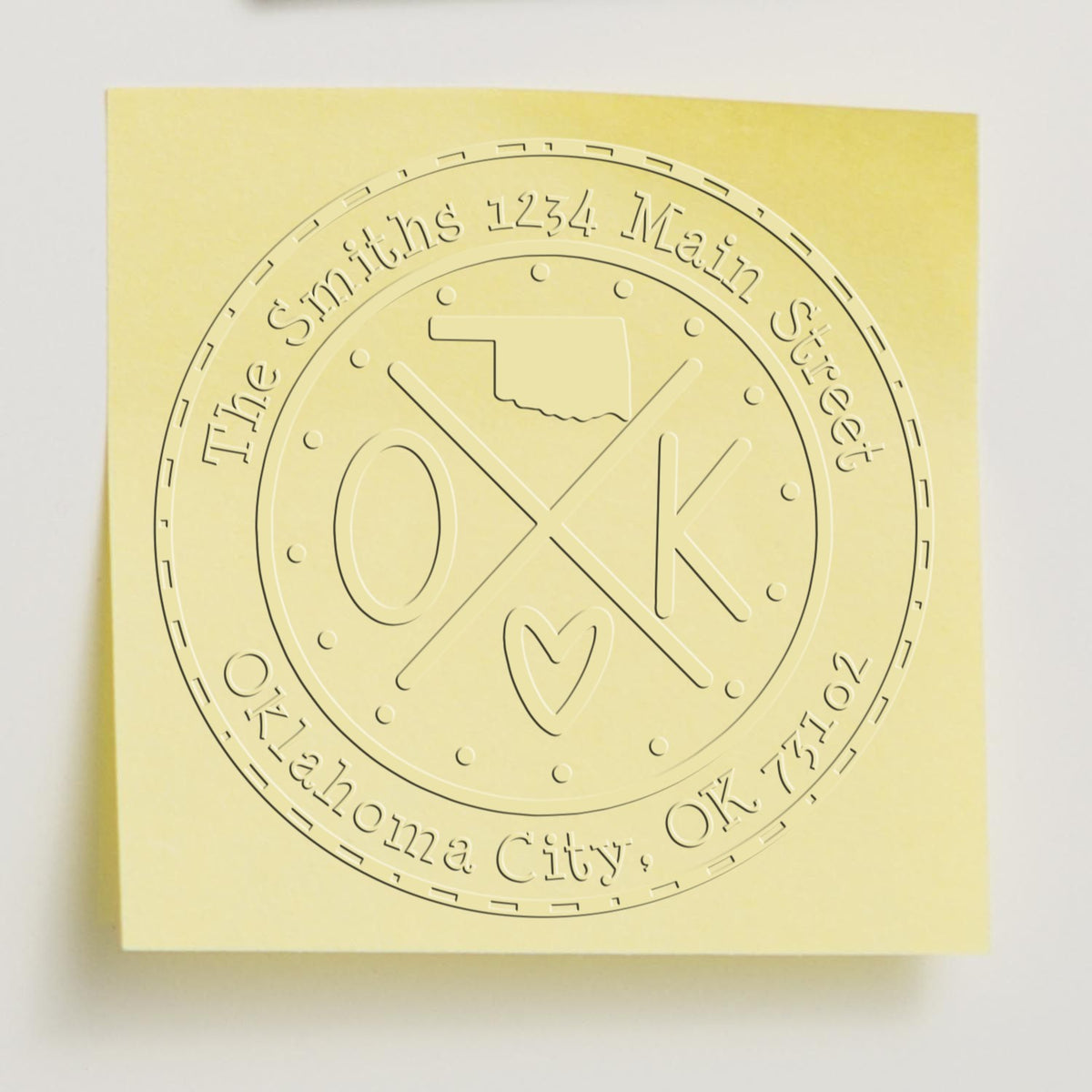 Trodat State Cross Hybrid Oklahoma return address embosser seal stamp in use, featuring customizable design and intricate state love details.