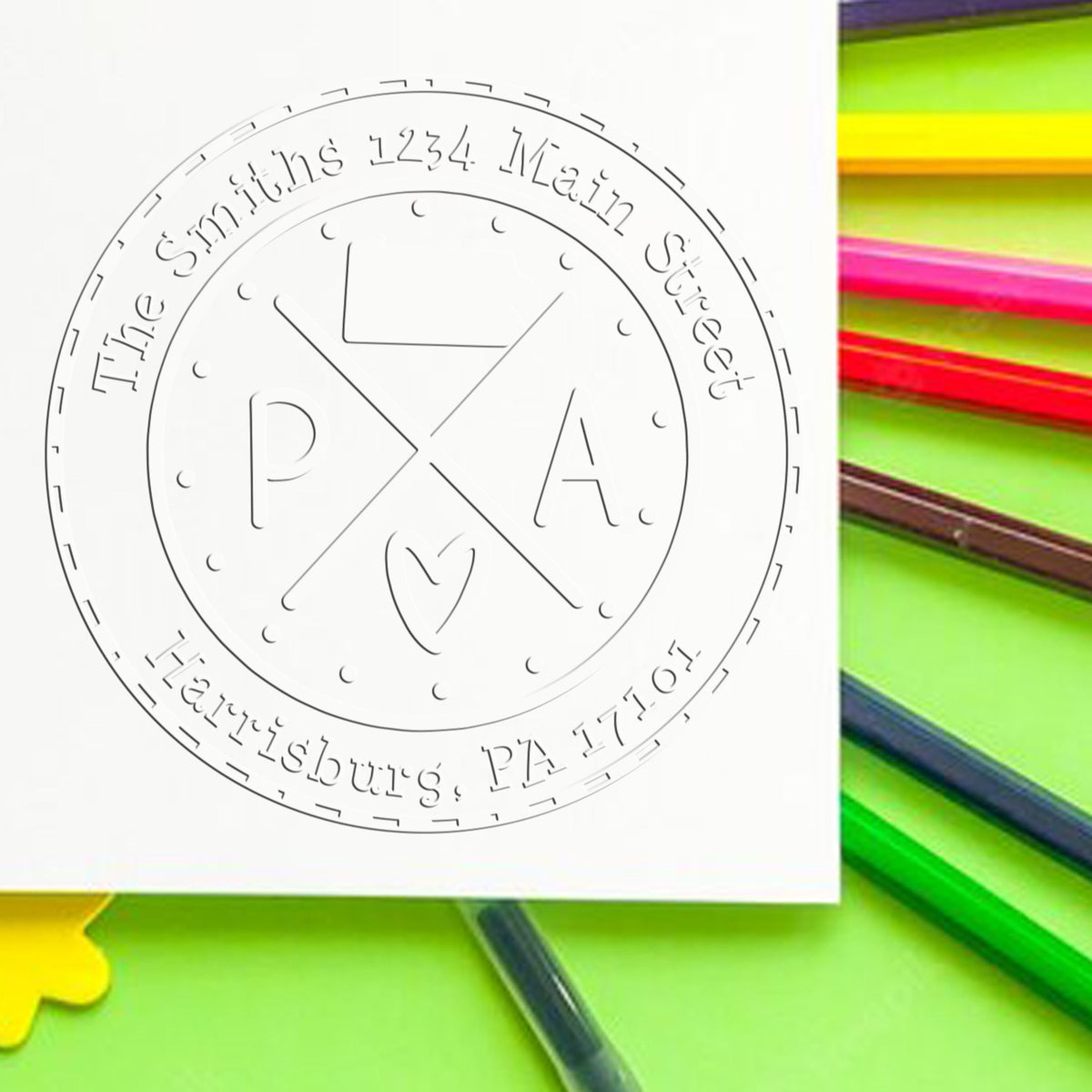White circular custom stamp seal reading The Smiths 1234 Main Street Harrisburg, PA 17101 on a bright green background.