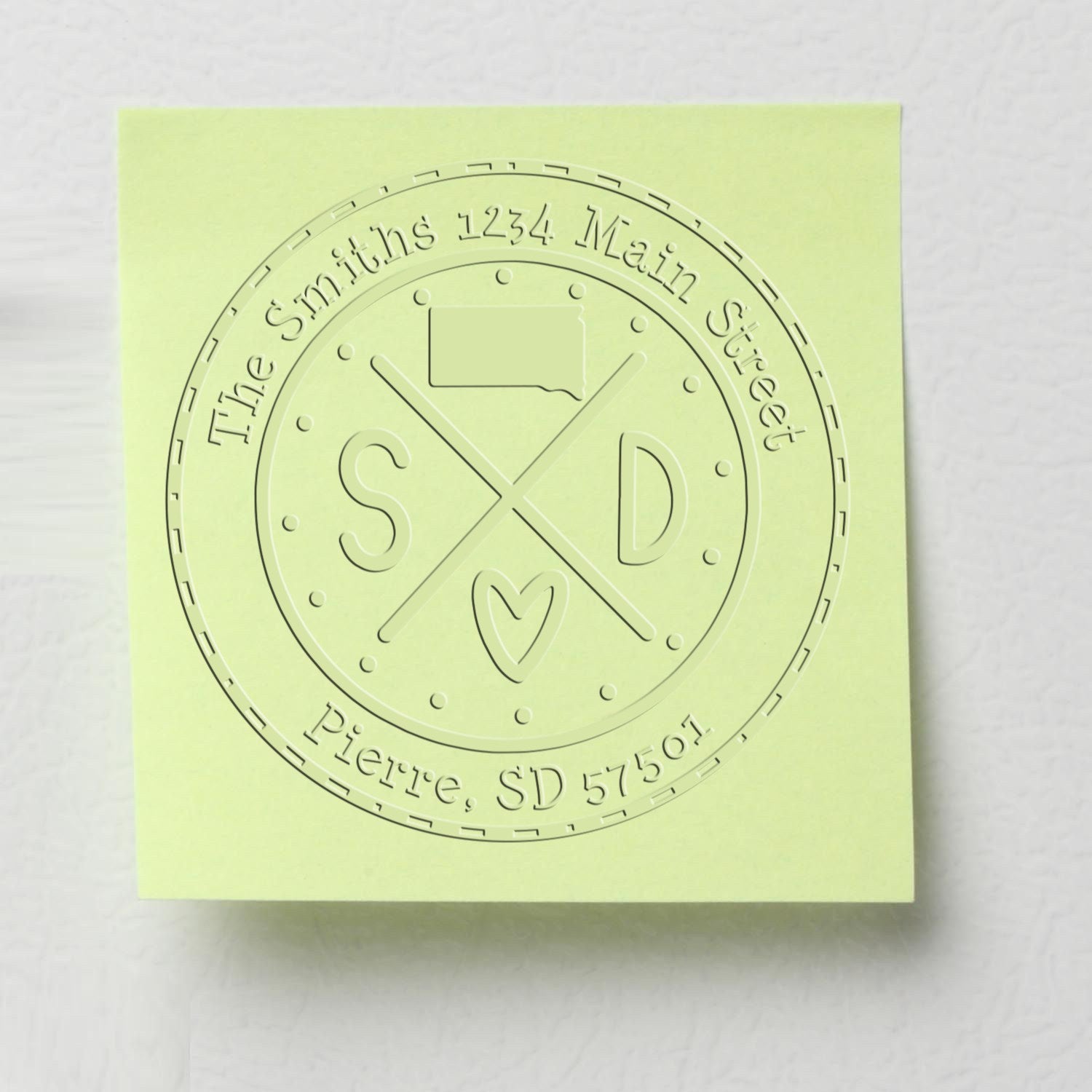 Light green custom embossing seal stamp with circular Smith's address design, crossed initials, and Pierre, SD 57501.
