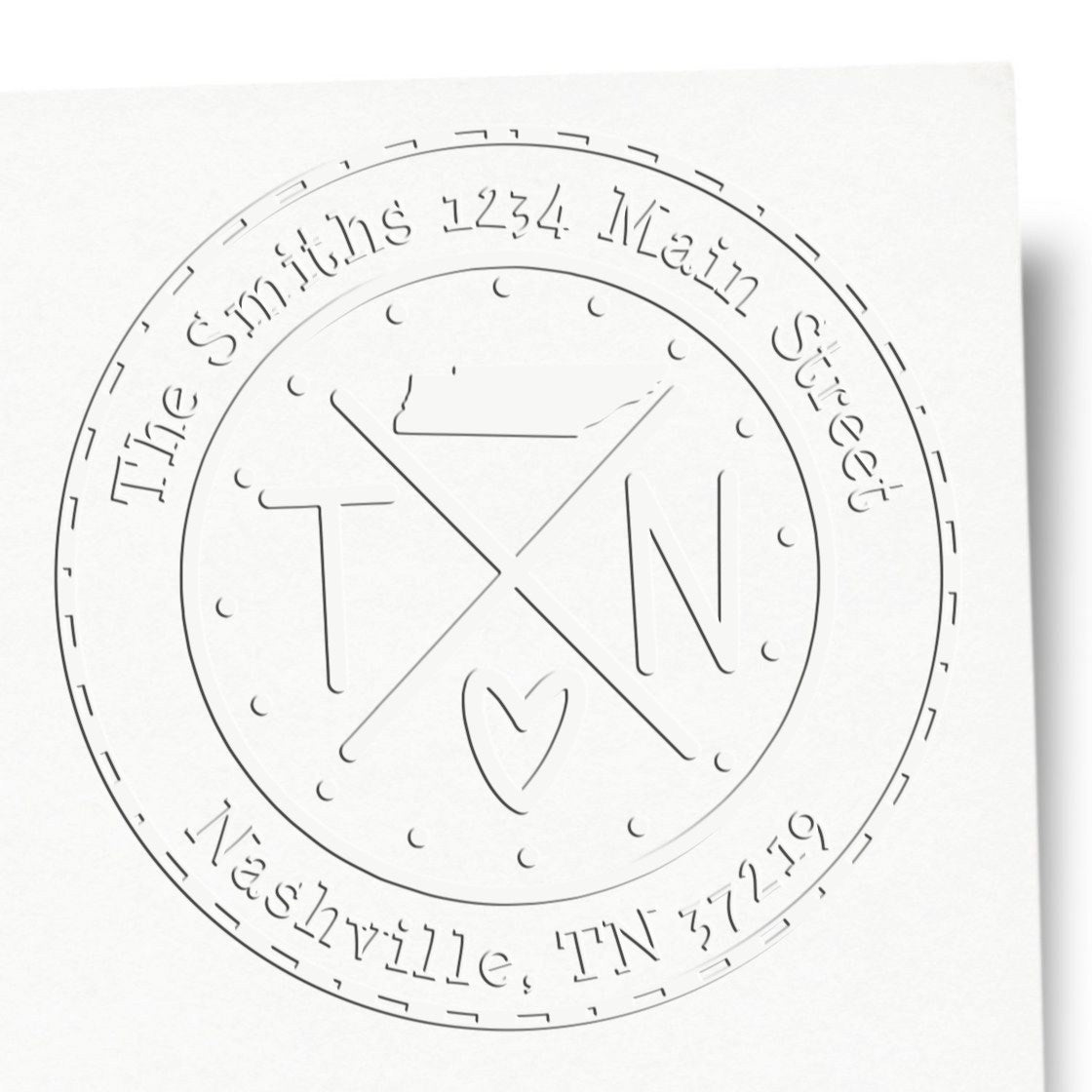 Embossed white circular stamp seal with gray text, The Smiths 1234 Main Street, Nashville, TN 37219, and a TN monogram.