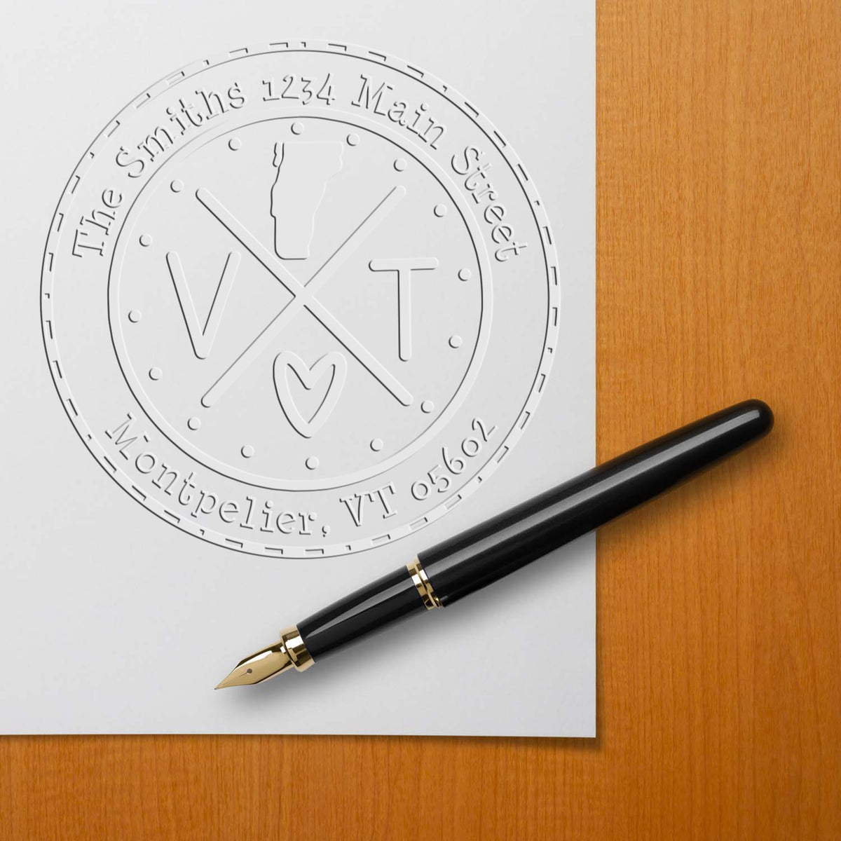 Trodat State Cross Hybrid Vermont address embossing seal from State Love Stamps in use, featuring customizable design and raised embossing.