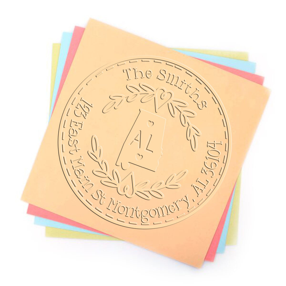Custom stamp and embossing seal on stacked peach, blue, pink, and yellow paper sheets