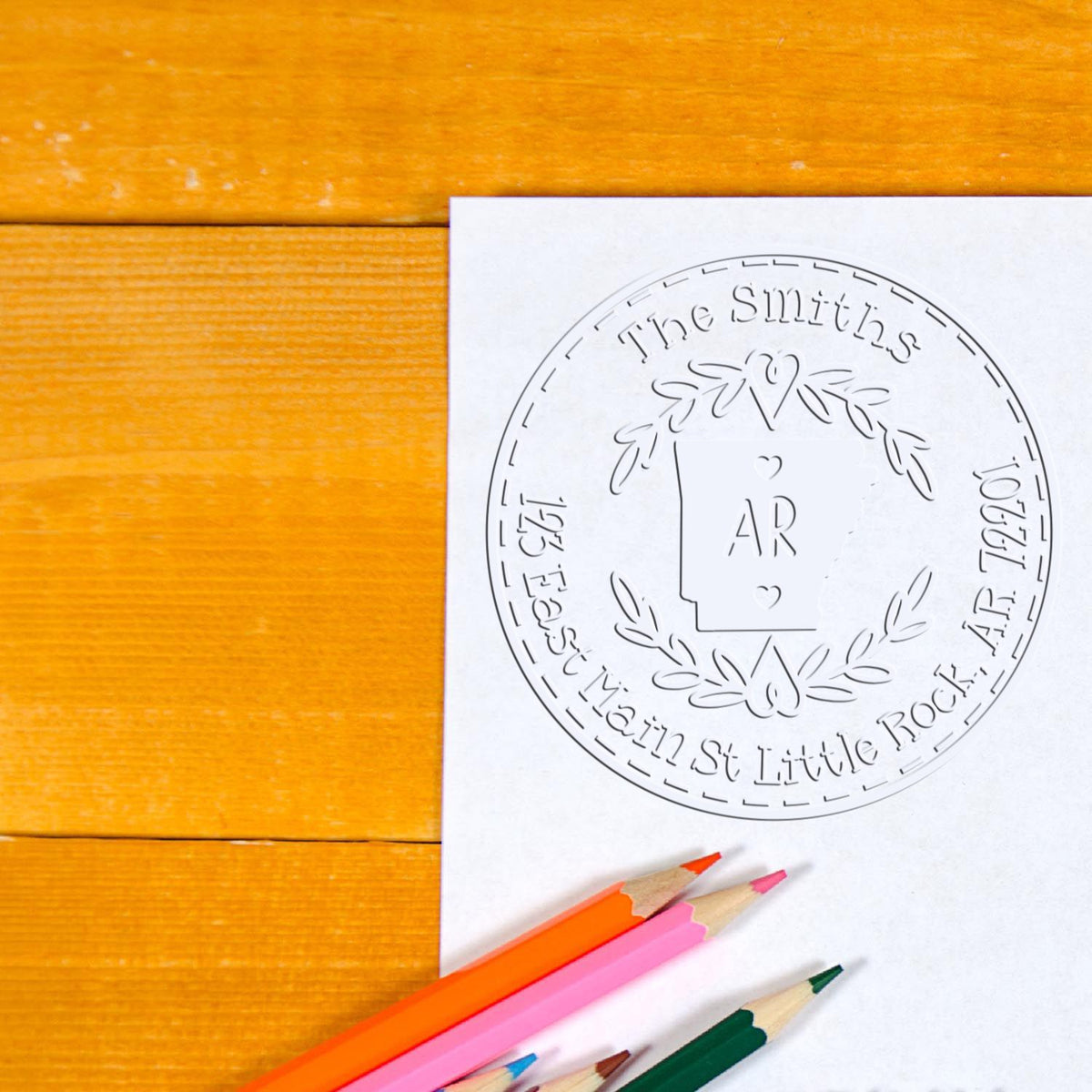 Custom stamp and seal design for The Smiths, white on paper with laurel wreath and colored pencils on wood.
