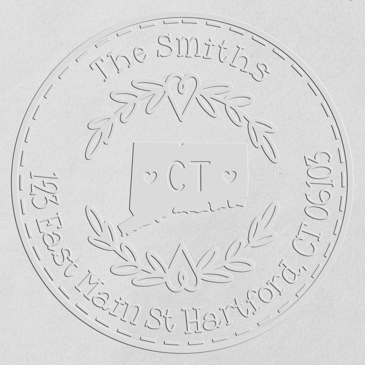 Trodat State Love Stamps CT custom return address embossing stamp in use, featuring a detailed state outline and personalized text.