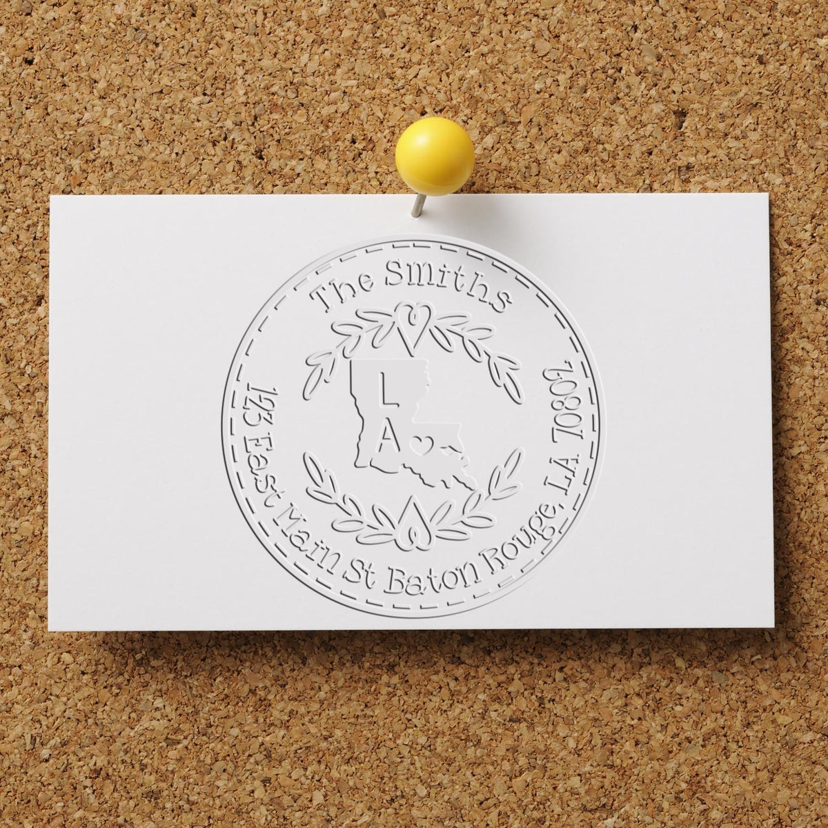 Trodat State Wreath LA Custom Address Return Seal Embosser with Louisiana state love stamp and decorative wreath design in use.