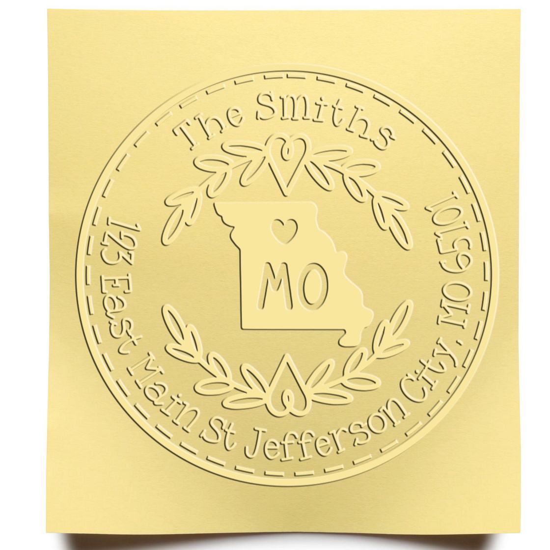 Gold embossed custom stamp and seal with Missouri outline, The Smiths, and laurel wreath on pale gold background.