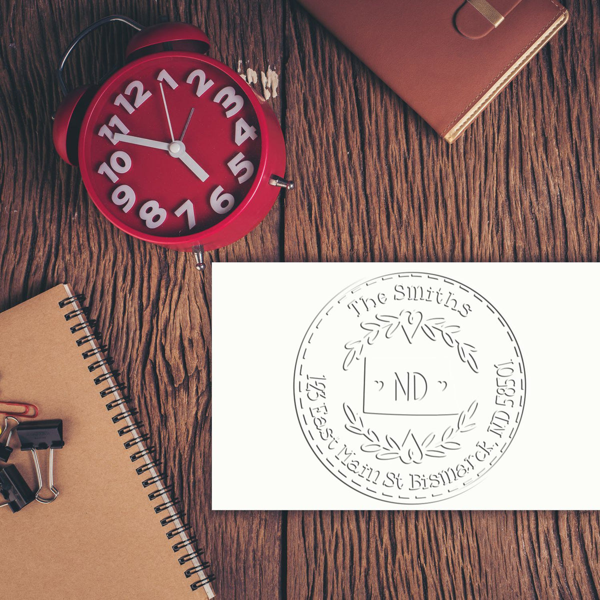 Trodat State Love Stamps ND custom mail address embossing seal in use, featuring a detailed state design for personalized stamping.