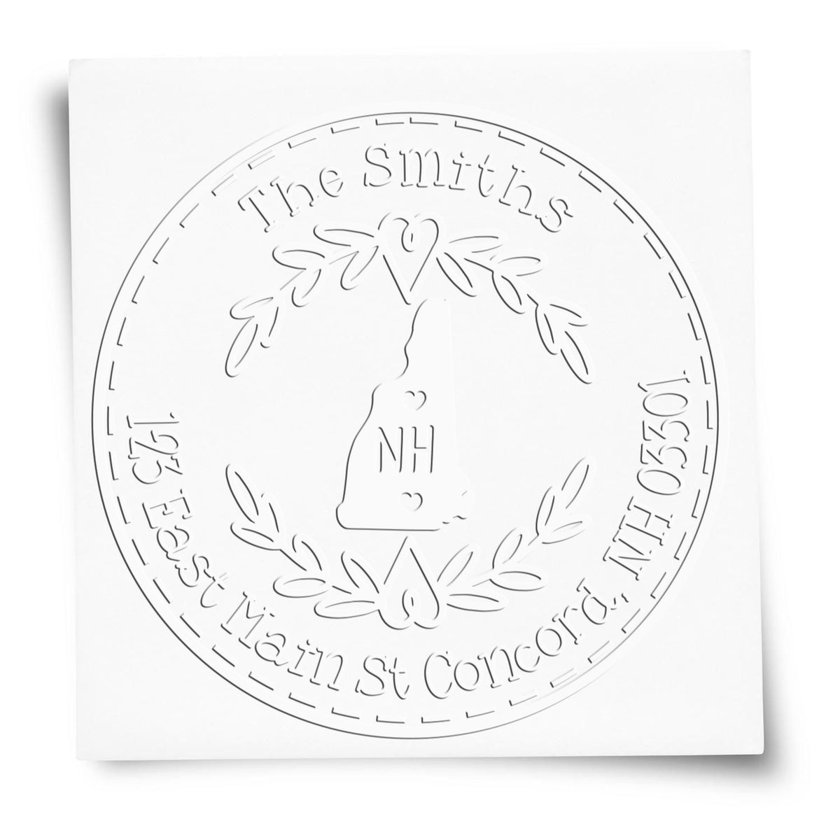 White round embossed stamp seal with floral wreath, heart, and The Smiths around NH monogram.