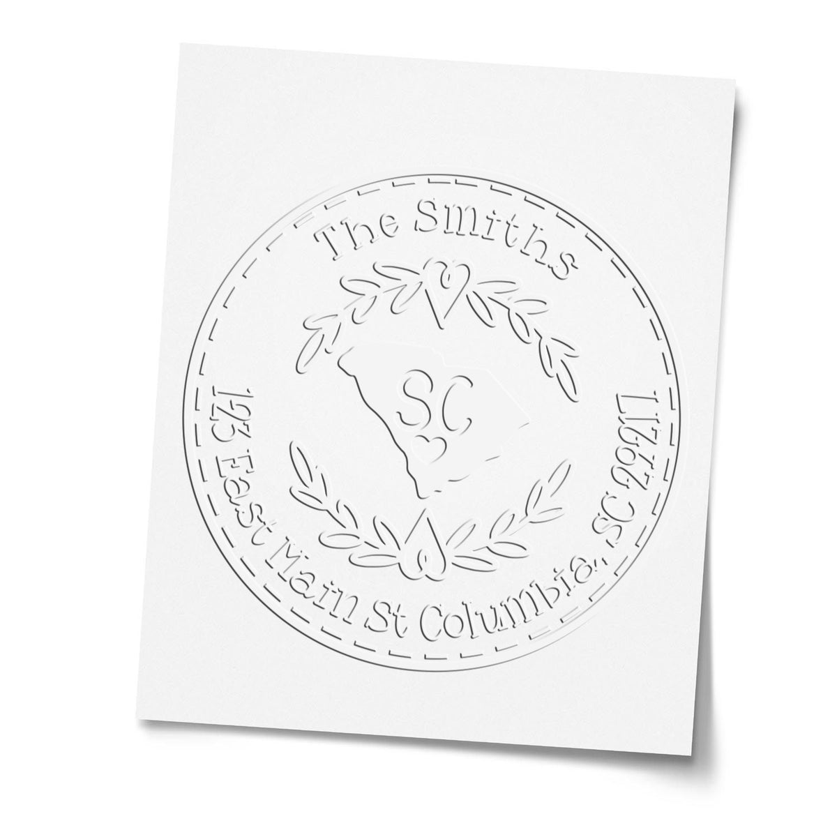 White embossed custom stamp seal with laurel wreath, SC monogram, and The Smiths text on white paper.