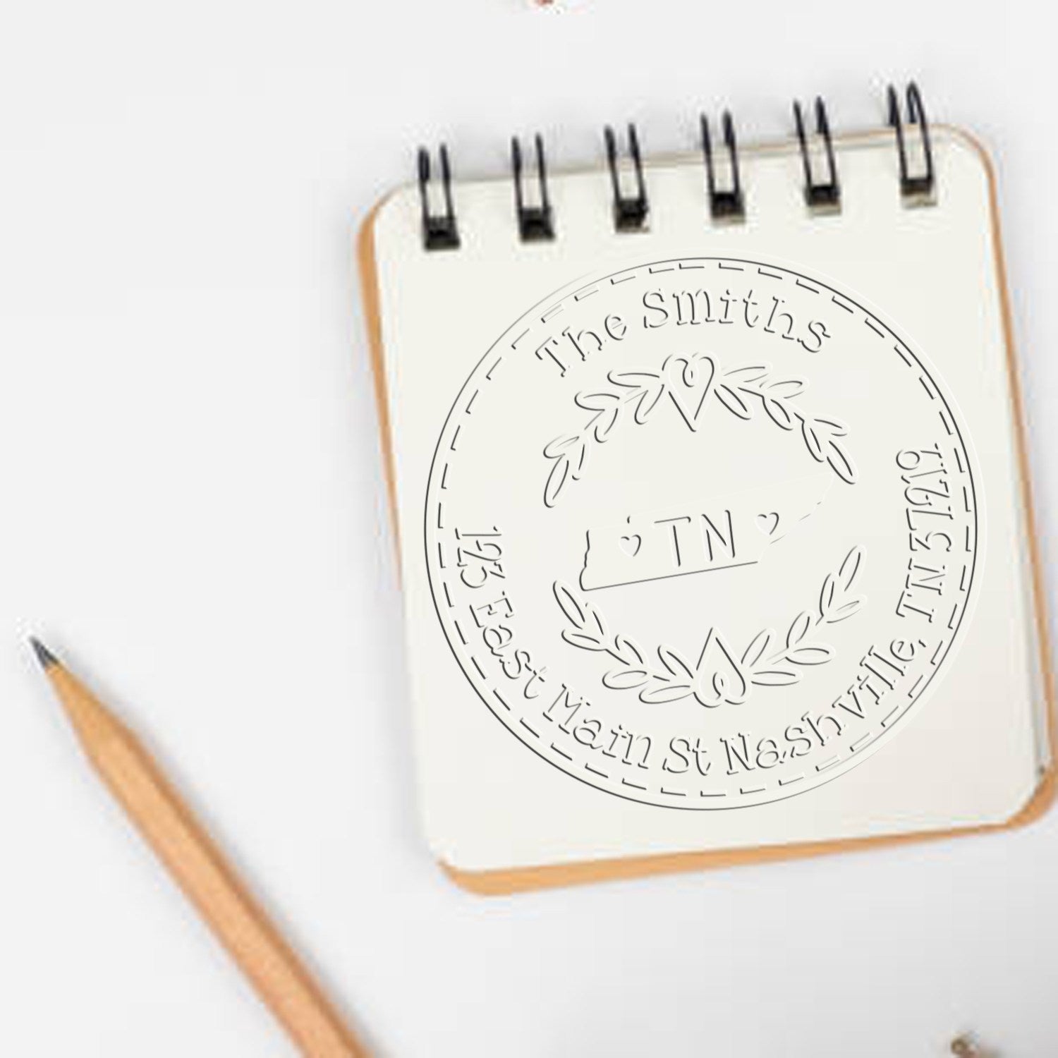 Trodat State Love Stamps Tennessee decorative mailing address embossing seal in use, featuring intricate state design for custom mailing.