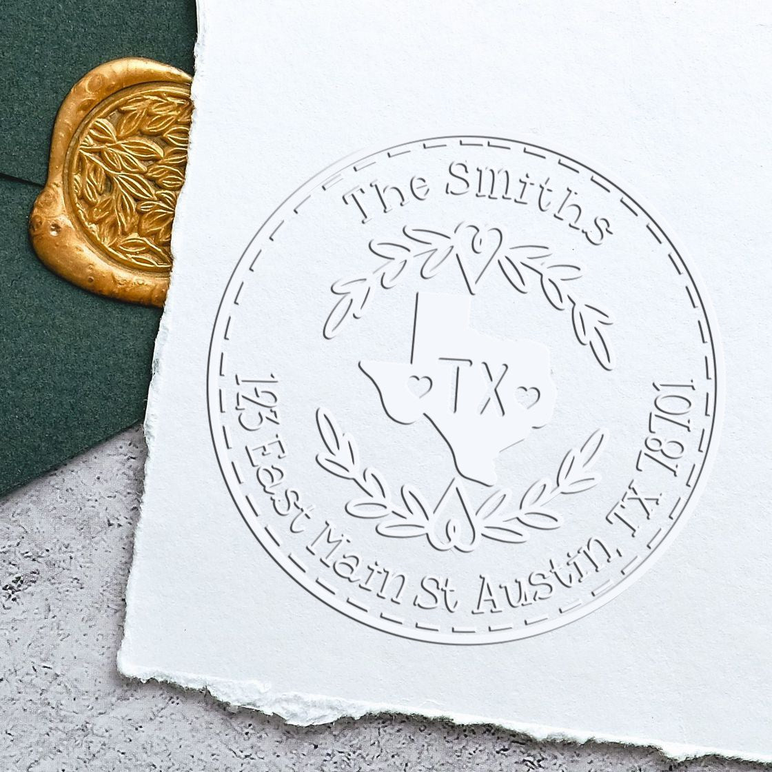 Embossed white circular Texas stamp seal with laurel wreath and gold wax seal on dark green background