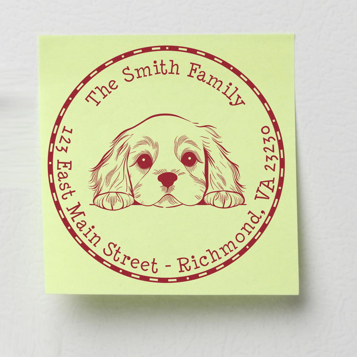 Custom burgundy stamp and seal with dog emblem on pale green paper, reading The Smith Family and address.
