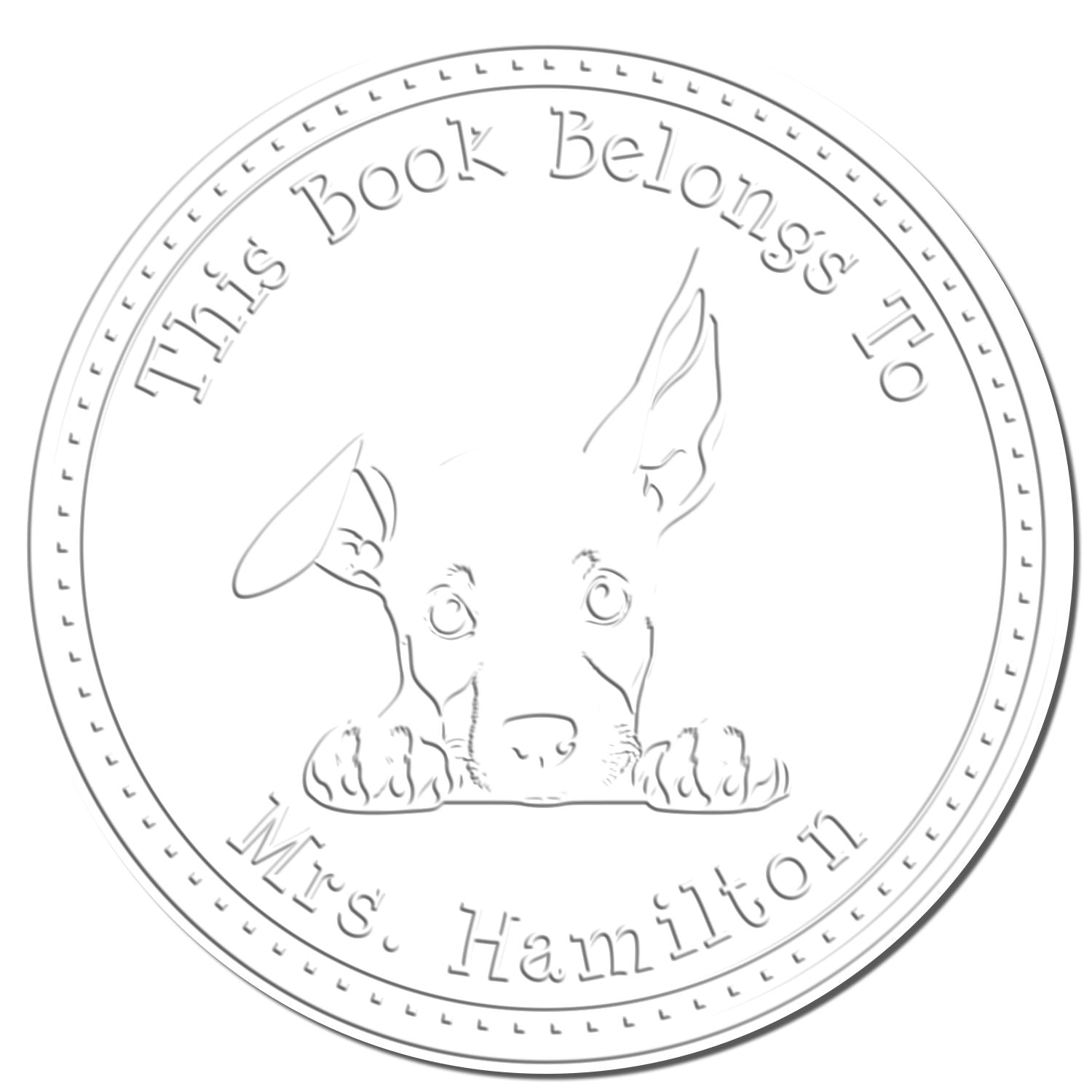 Circular gray book stamp seal with dog illustration and text This Book Belongs To Mrs. Hamilton