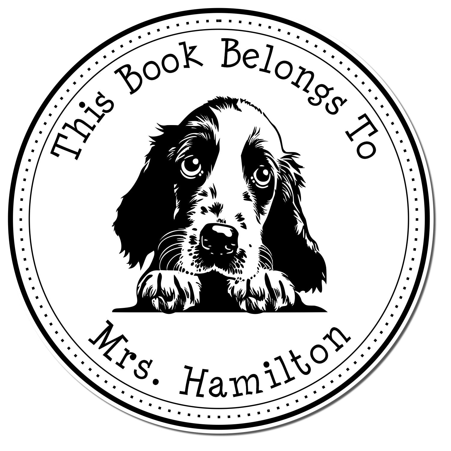Black-and-white circular stamp seal reading This Book Belongs To Mrs. Hamilton with a puppy and dotted border.
