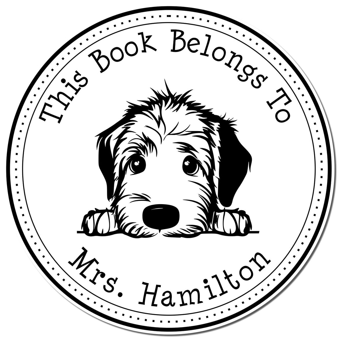 Black-and-white circular personalized book stamp seal with puppy face and text: This Book Belongs To Mrs. Hamilton.