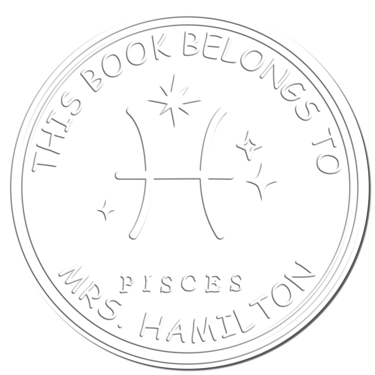Light gray circular Pisces book seal stamp with stars and embossed text This Book Belongs To Mrs. Hamilton.