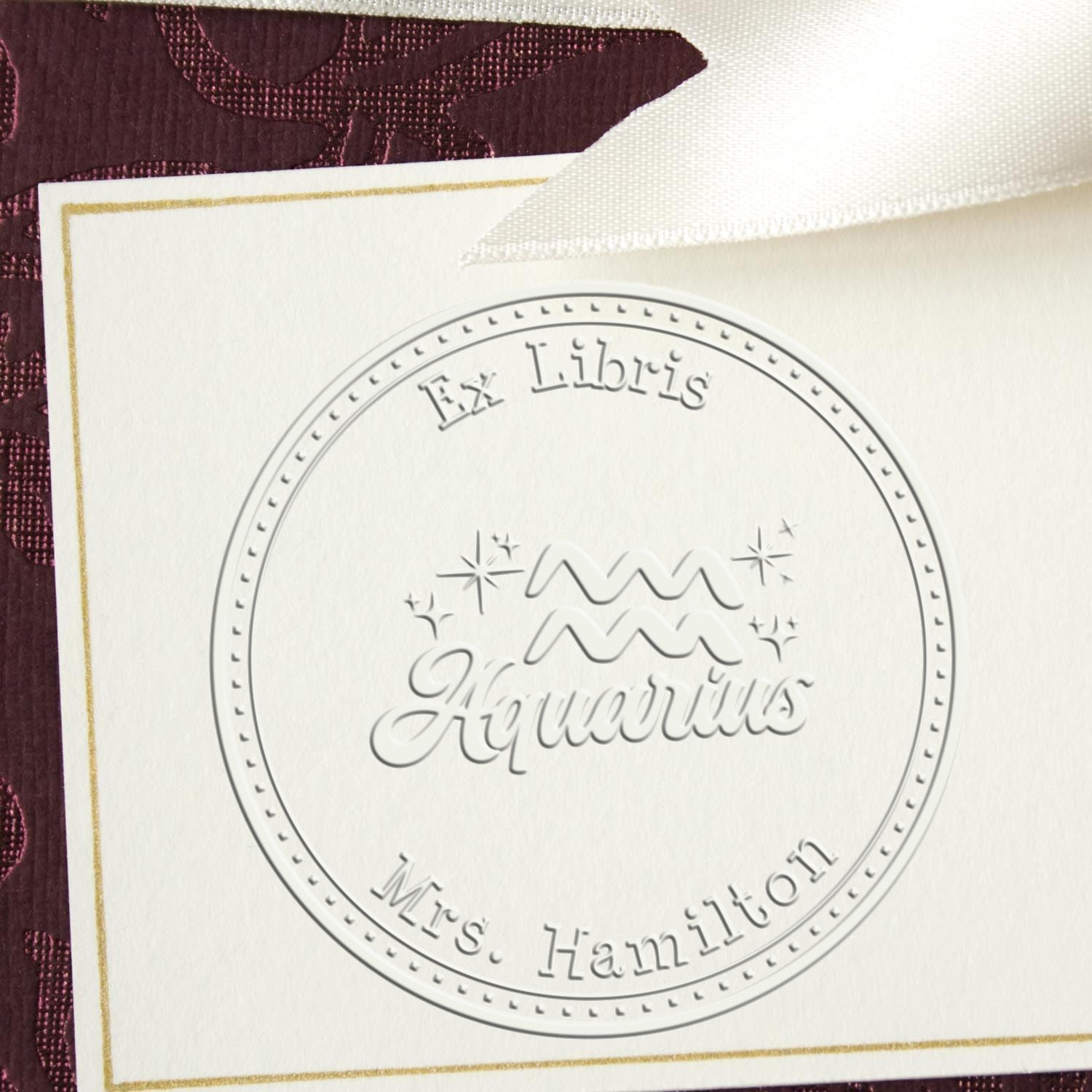 Soft Aquarius Zodiac Symbol with Scripted Font Personalized Bibliophile Paper Embosser
