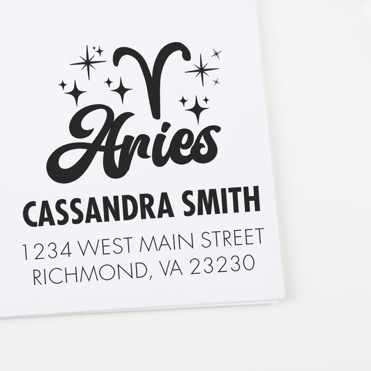 Black custom stamp and seal for Aries Cassandra Smith with stars and Richmond, VA address