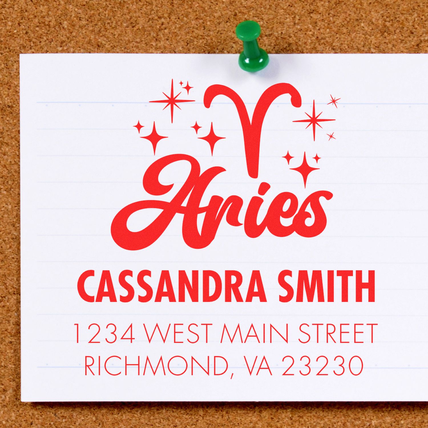Red Aries stamp seal with sparkles on white paper, pinned to corkboard; Cassandra Smith, Richmond, VA address below.