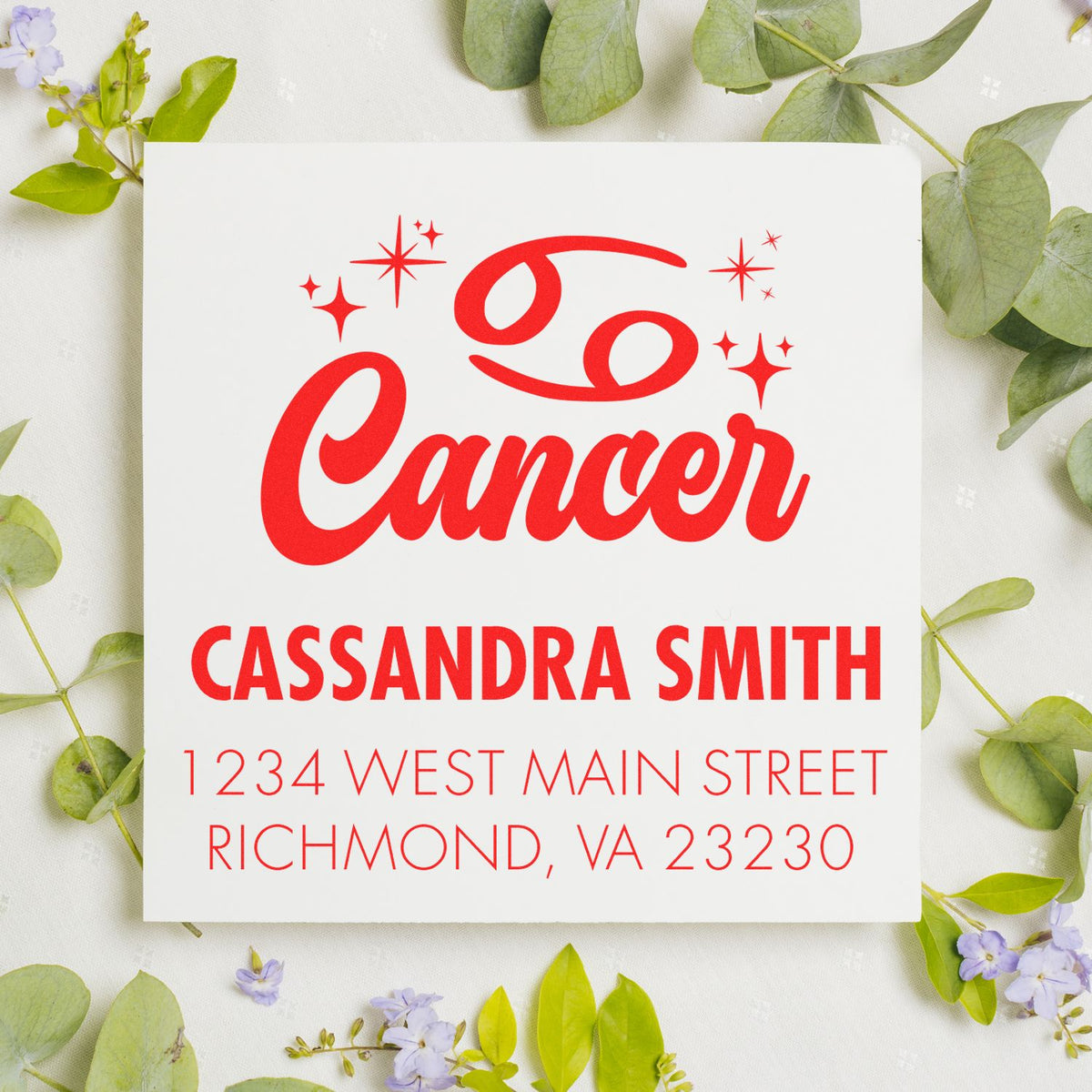 Custom red Cancer awareness stamp and seal with ribbon, sparkles, Cassandra Smith address on white card, framed by green leaves