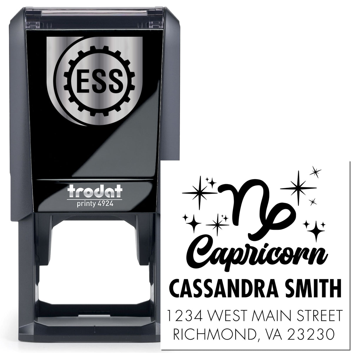 Black self-inking Trodat Printy 4924 stamp and seal with silver-black Capricorn design, Cassandra Smith name, and address.