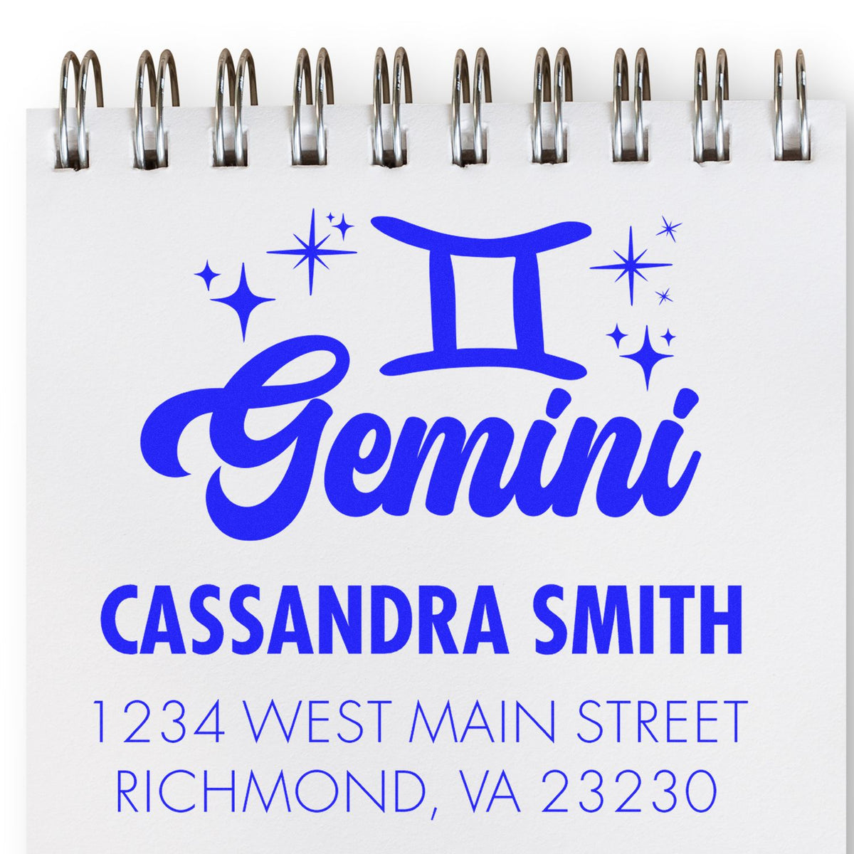 Blue Gemini stamp and seal on white spiral notebook, with Cassandra Smith name and Richmond, VA address.