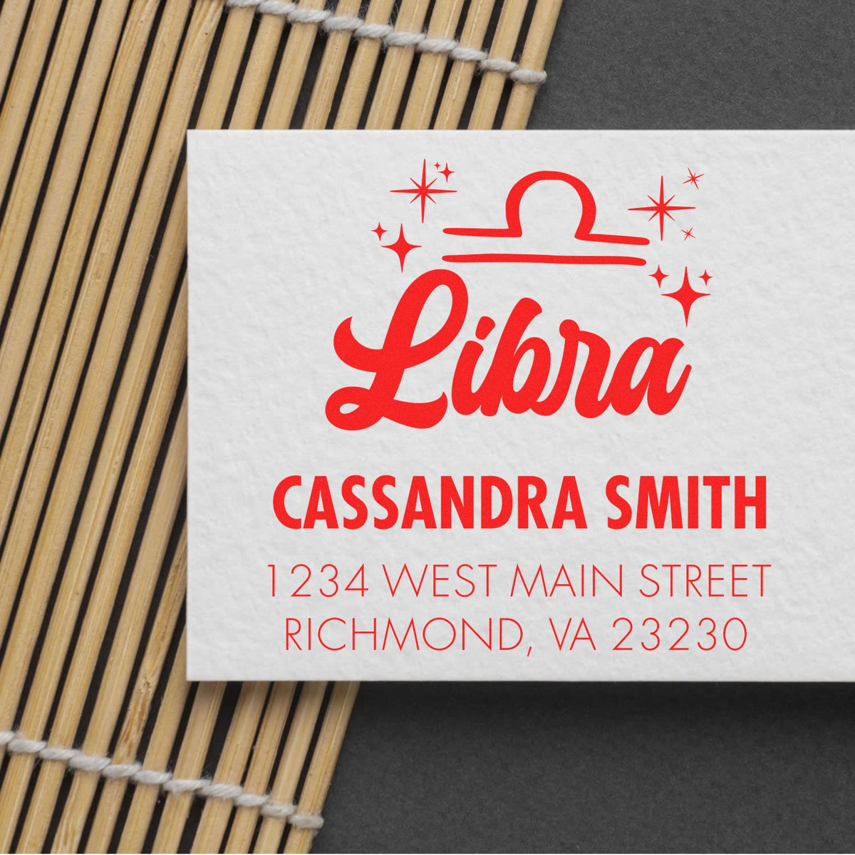 Red custom stamp seal for Libra, featuring Cassandra Smith and Richmond, VA address on a white card.