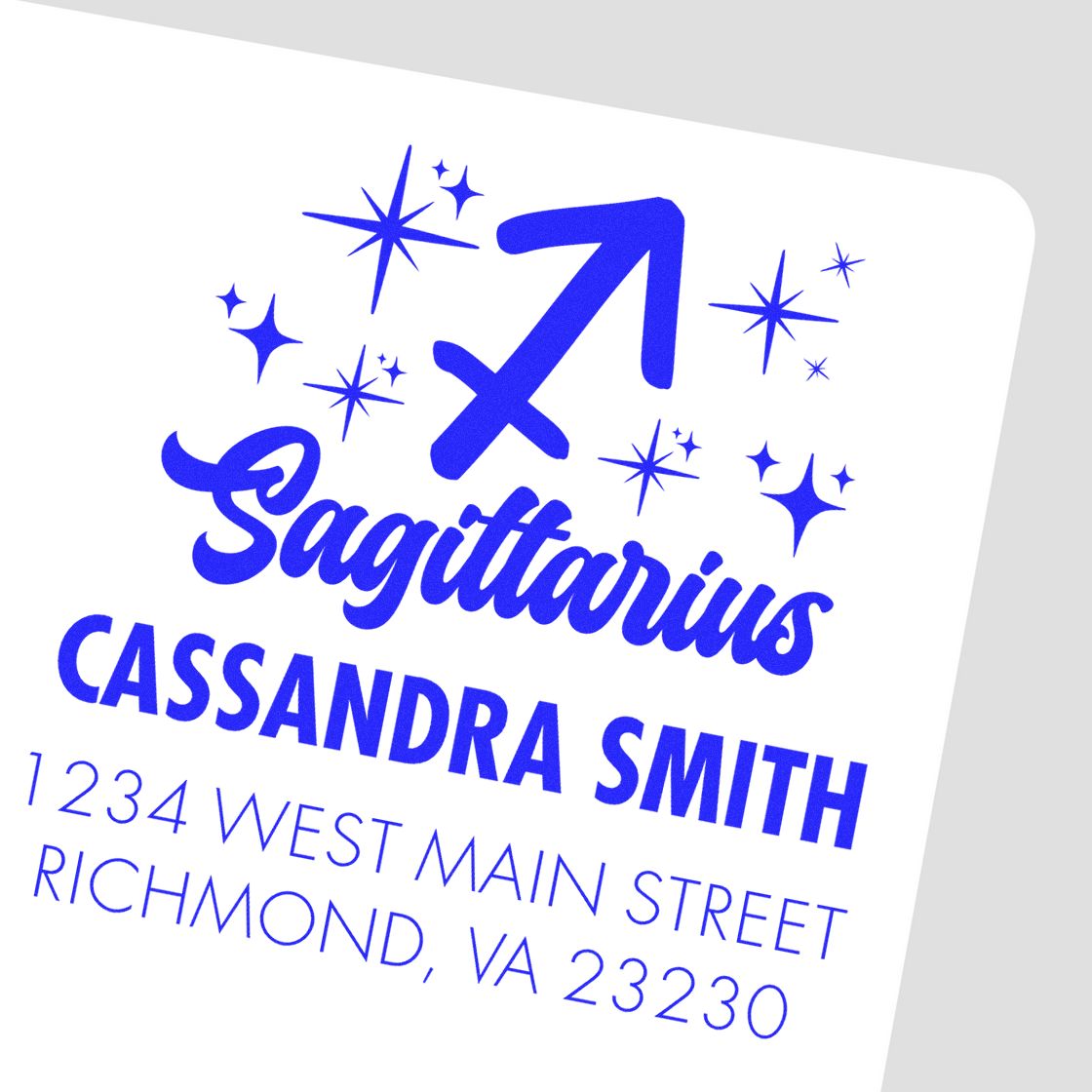 Bold royal blue Sagittarius stamp and seal with stars, Cassandra Smith, and Richmond, VA address on white background.