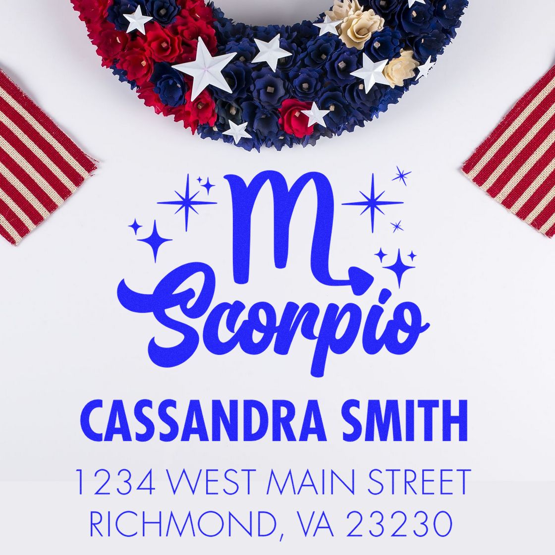 Blue Scorpio custom stamp and seal with Cassandra Smith address, star accents, and red, navy, and white floral patriotic wreath.