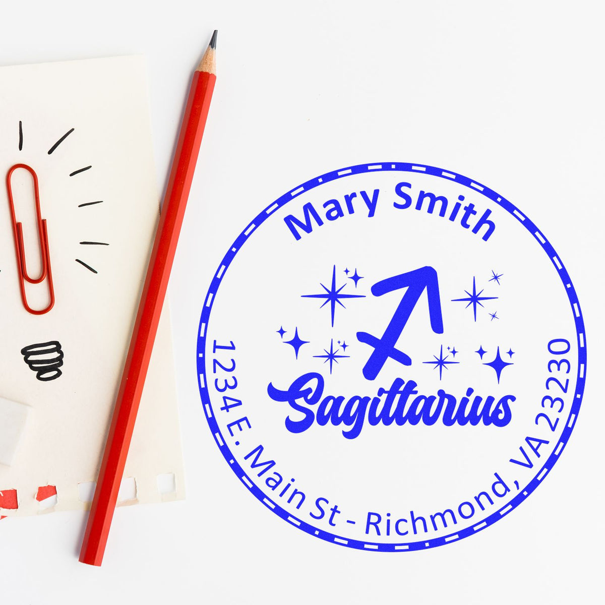 Blue custom self-inking stamp seal for Mary Smith, Sagittarius, with stars and Richmond, VA address on white background.