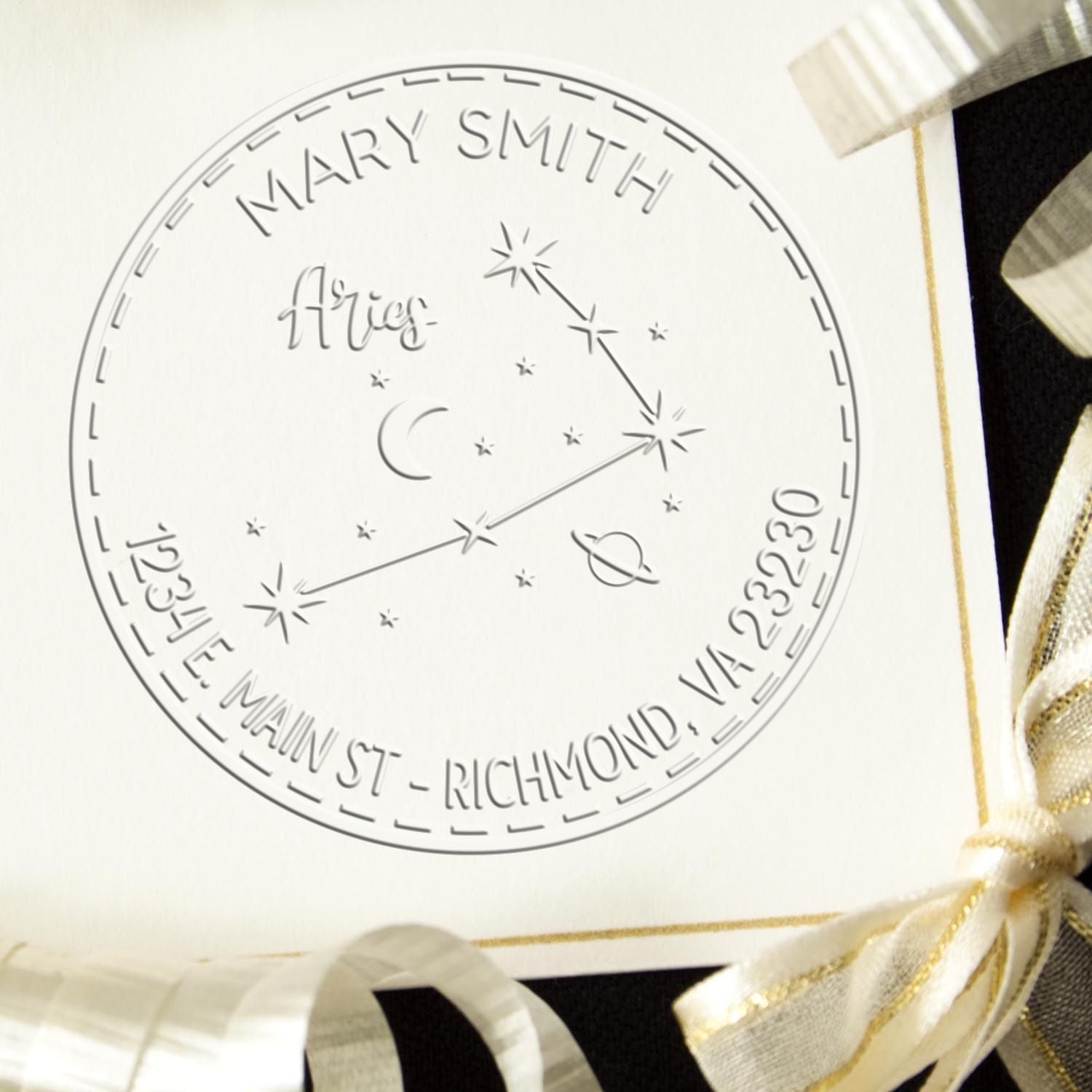 White circular stamp seal with gray Virgo constellation, Mary Smith name, and gold ribbon accents.