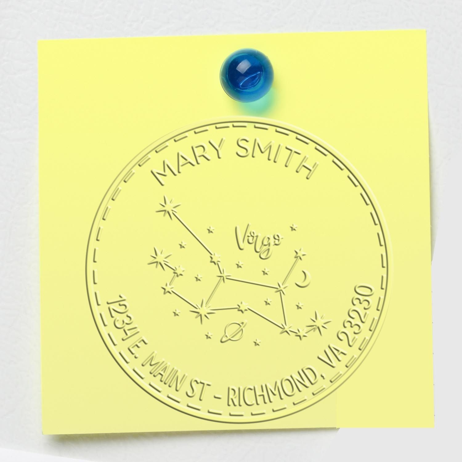 Pale yellow stamp and seal with embossed Virgo constellation, Mary Smith name, and Richmond, VA address, pinned with a blue tack.