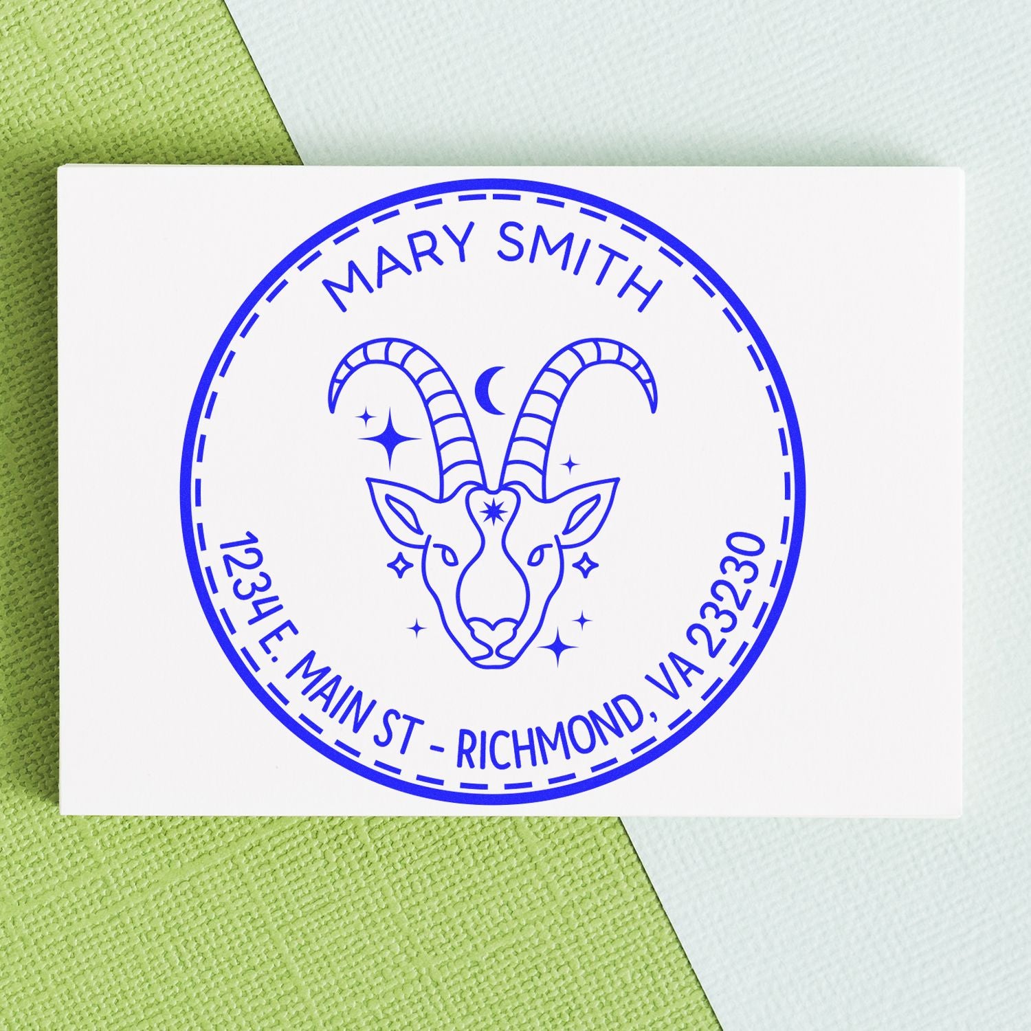 Blue custom stamp seal with a goat head logo, Mary Smith name, and Richmond, VA address on a white card.