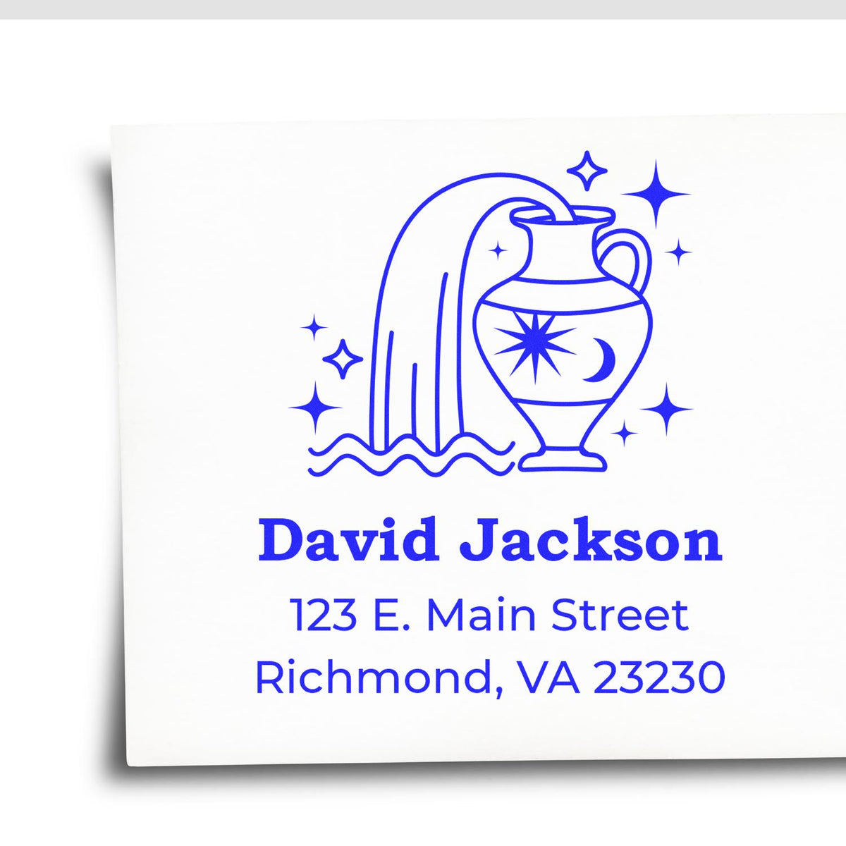 Blue custom stamp seal design with vase, moon, sparkles, and David Jackson address in bold blue on a white card.