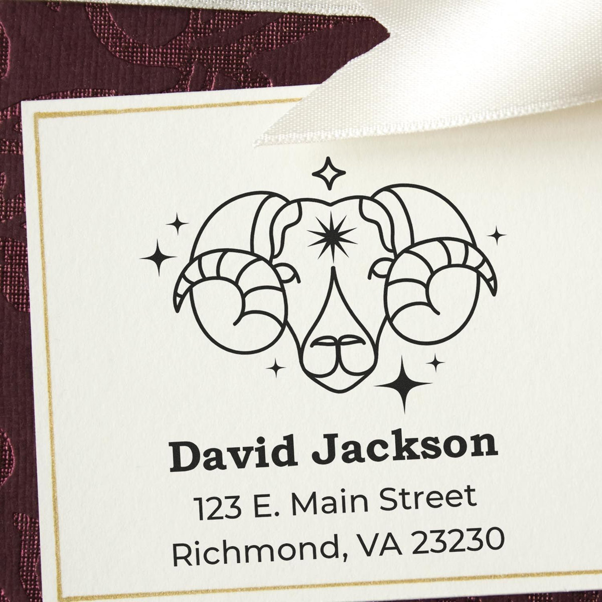 Custom black ram head stamp and seal with gold border on white card for David Jackson