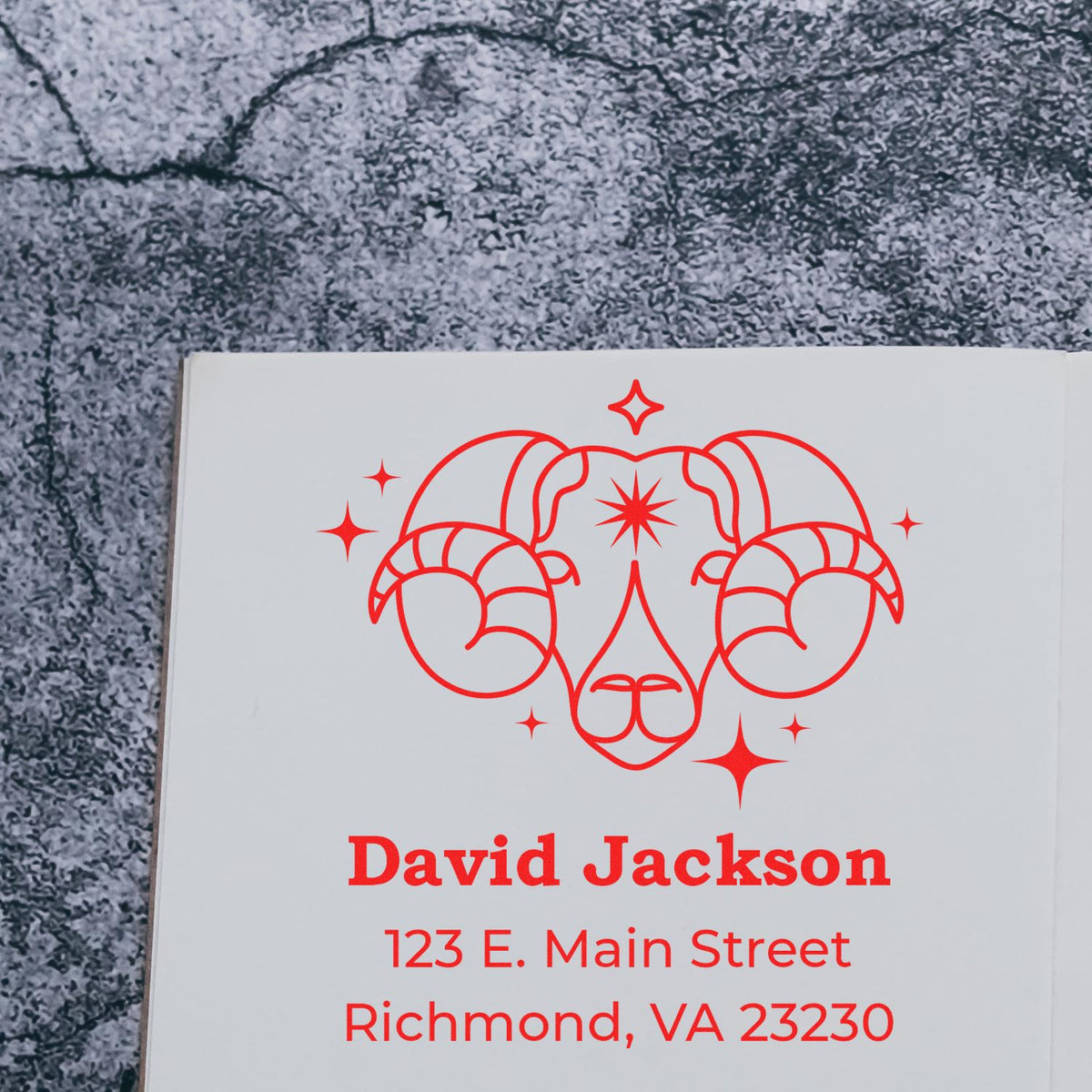 Custom red ram-head stamp and seal on white card with David Jackson name and Richmond, VA address.