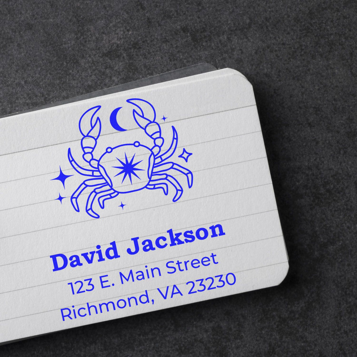 Blue crab stamp and seal on white lined card, with moon and stars above David Jackson address.
