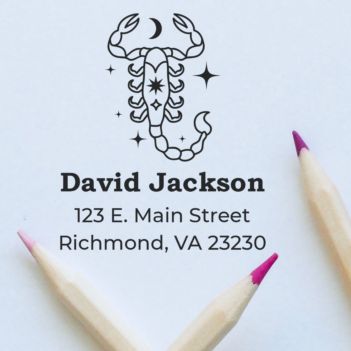 Black scorpion stamp seal with David Jackson name and Richmond, VA address on white paper, framed by pink-tipped pencils.