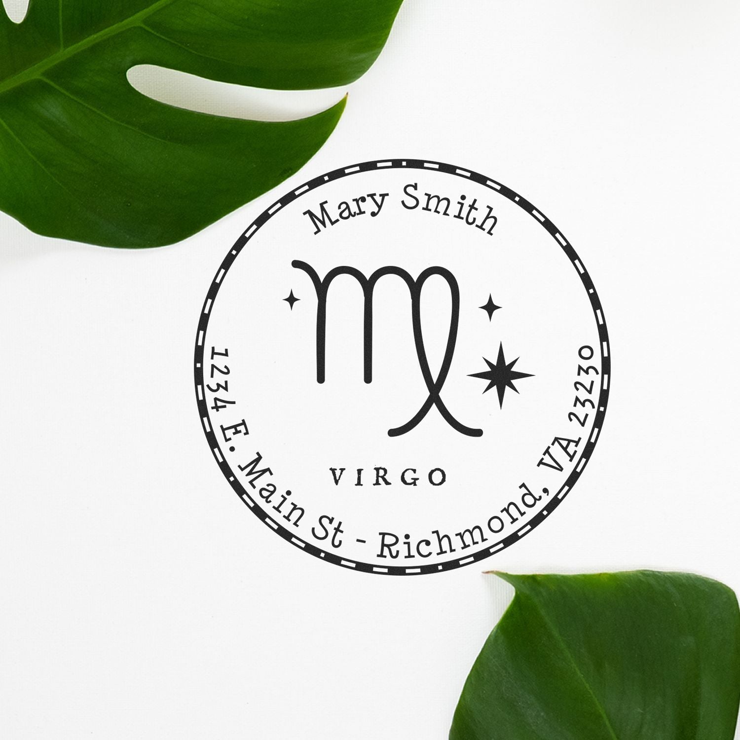 Black Virgo custom stamp seal with Mary Smith name and address on white background, framed by green leaves.