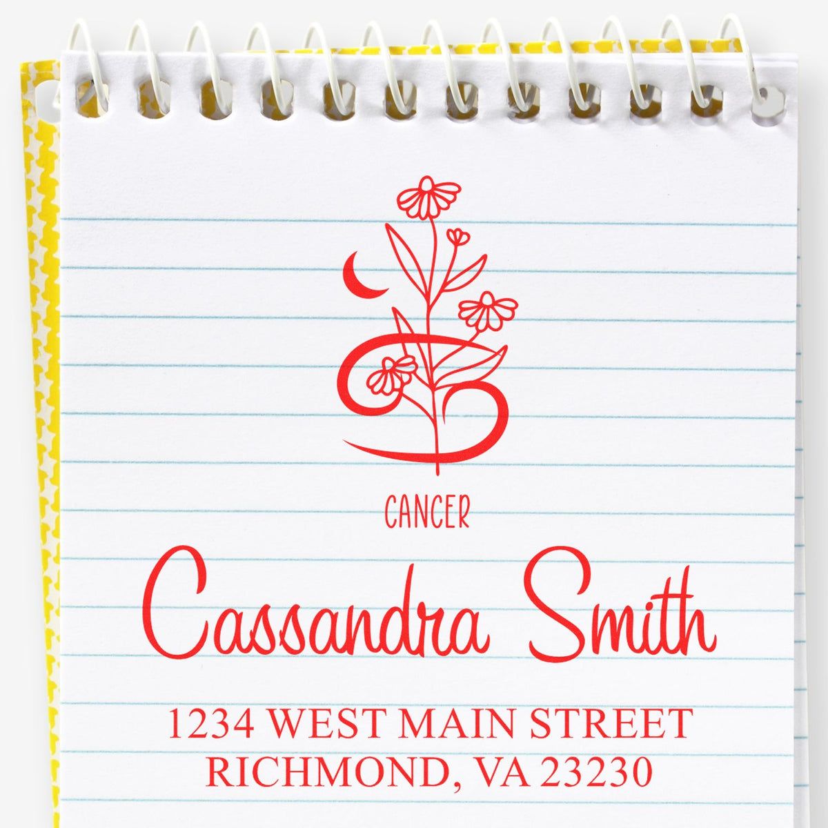 Custom red Cancer floral stamp and seal with Cassandra Smith name and Richmond, VA address on spiral notepad.